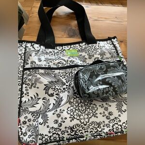 Super cute oil cloth bag with cosmetic bag.